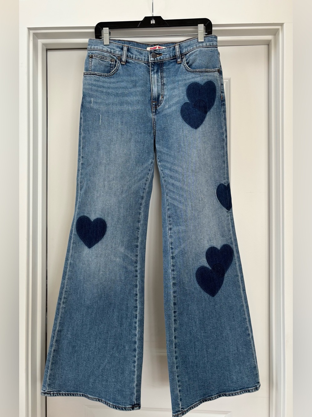 NWOT Johnny Was jeans with heart patches.  Size 28.
